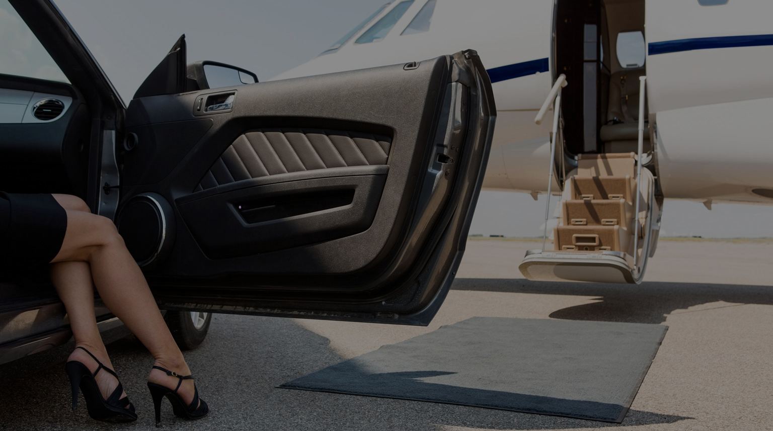Stepping from a car toward a waiting private jet